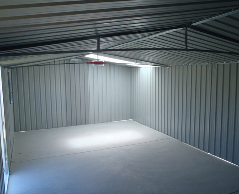 Image of inside of a garden shed with a concrete floor